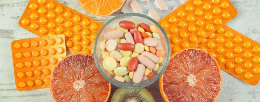 Natural fruits and medical pills. Choice between eating fruits and supplements
